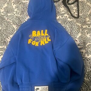 Nike zip down blue sweatsuit 
PLEASE LOOK AT PICTURES BEFORE PURCHASING ITEM